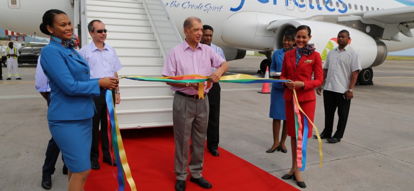 President James Michel cuts a ribbon to welcome the new aircraft to Seychelles