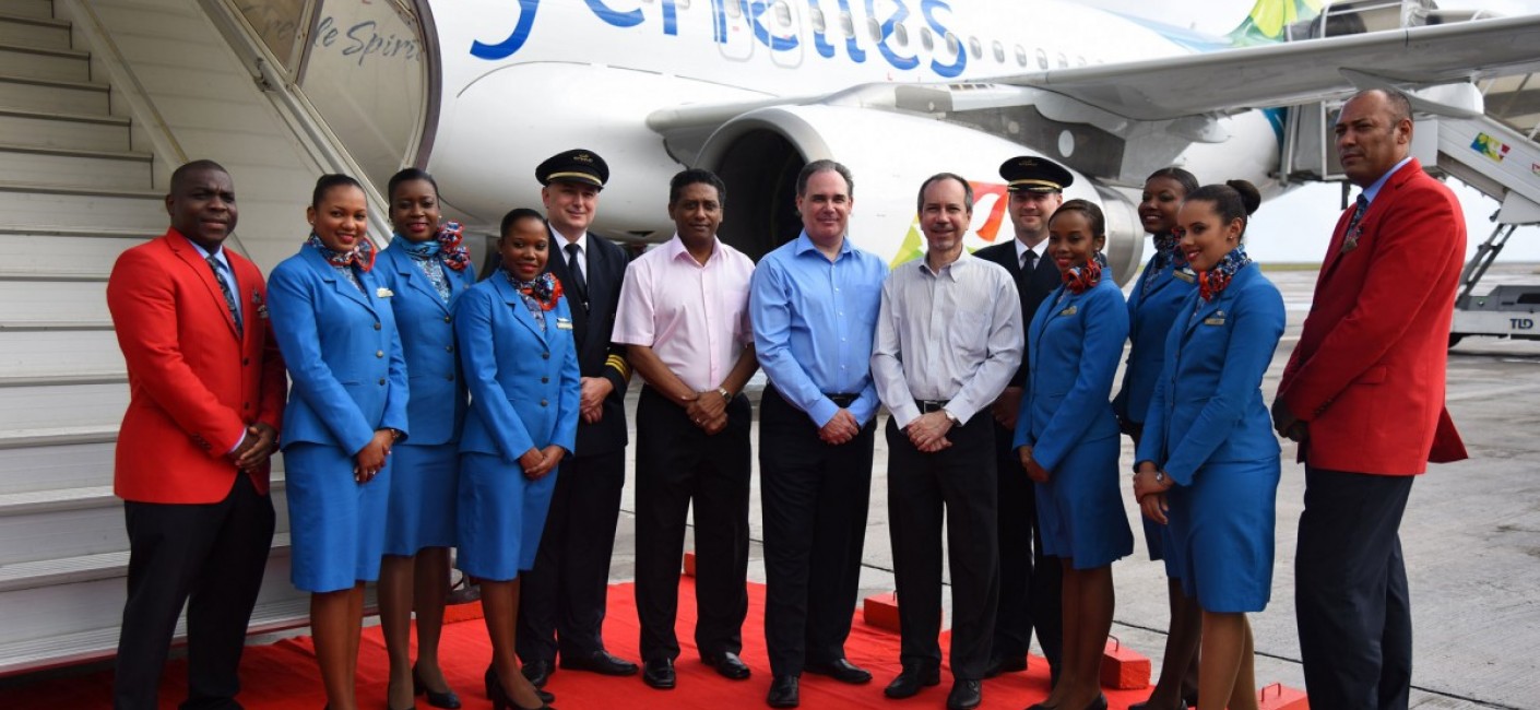 Vice President of Seychelles, Danny Faure, Chief Executive Officer of Air Seychelles, Roy Kinnear and Minister of Foreign Affairs and Transport and Chairman of Air Seychelles, Joël Morgan, stand next to the Seychellois pilots and cabin crew who operated ‘Silhouette’s’ first flight from Abu Dhabi to Seychelles