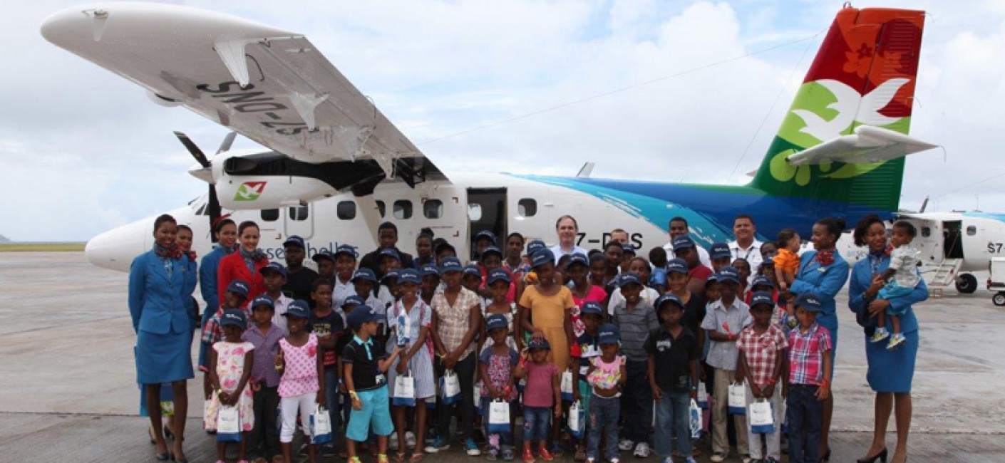 Air Seychelles CEO with children: Air Seychelles CEO Roy Kinnear and children from the President’s Village and Anse Boileau school