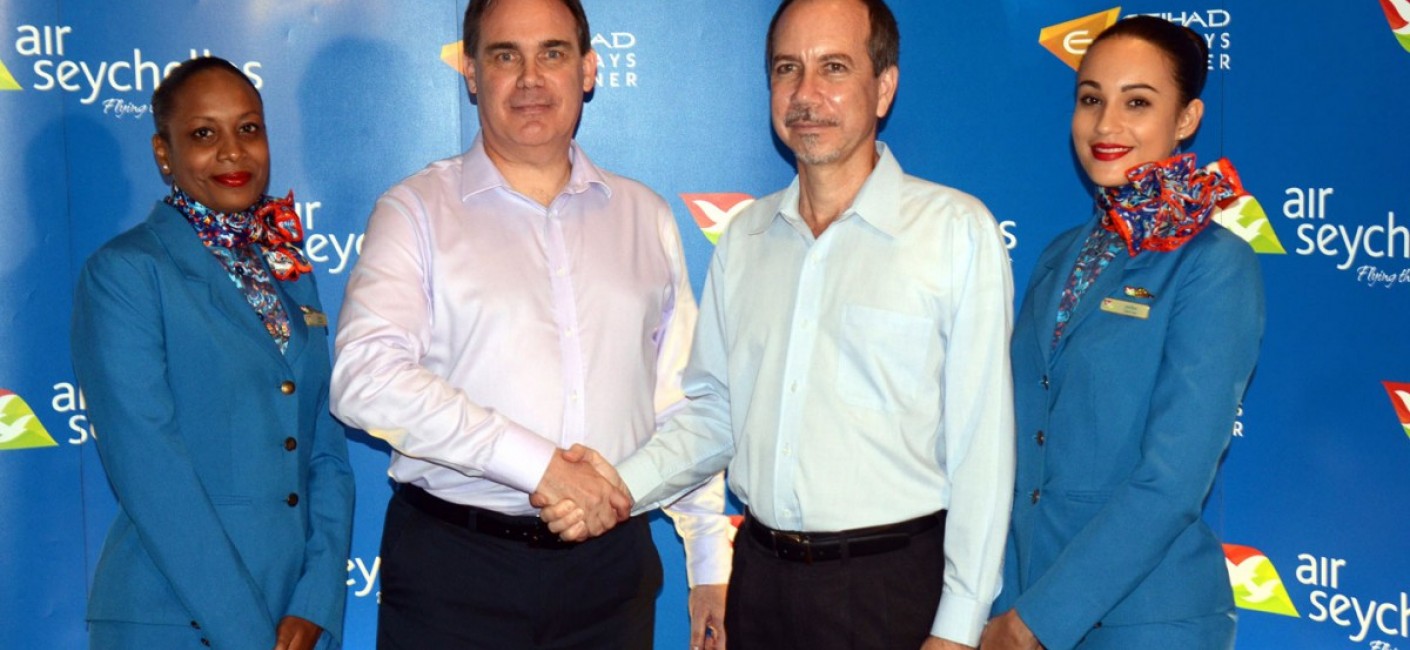 Minister Joël Morgan shakes hands with Roy Kinnear, the incoming Chief Executive Officer of Air Seychelles